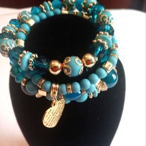 Brand new Coral blue and gold four-piece beautiful beaded bracelets fits most